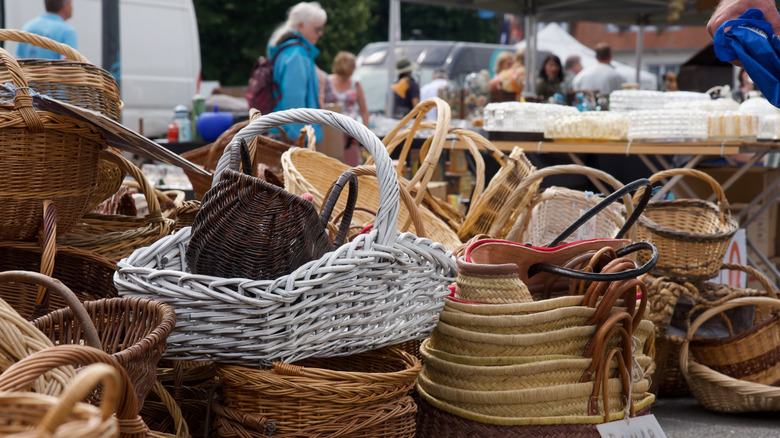 A pile of woven baskets at an outdoor flea market