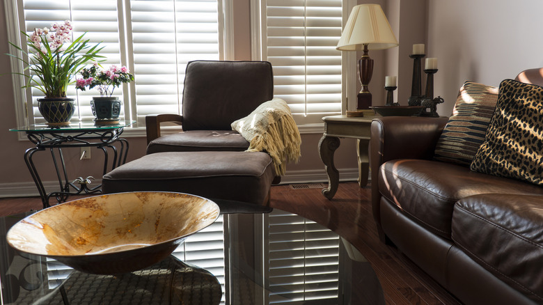 Modern living room with leopard print pillow on couch