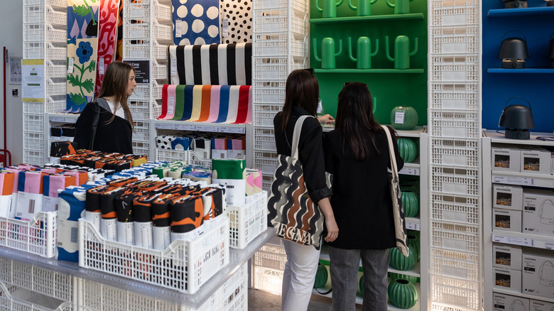 IKEA shoppers look at colorful new items on display