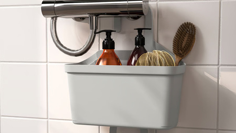 Bath products are stored in a hanging gray shower basket
