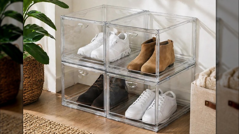 Four pairs of shoes are stored in a clear stackable organizer