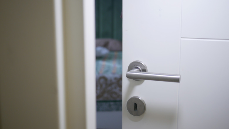 a slightly open bedroom door