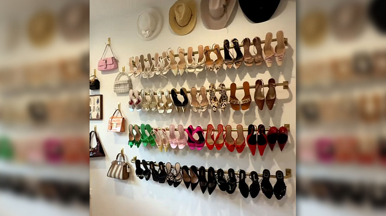 Shoes and purses hung on the wall