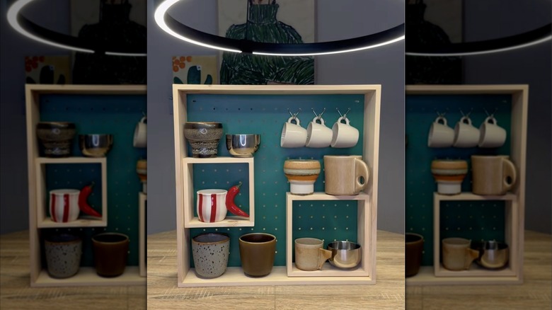 An IKEA display shelf being used for mug storage