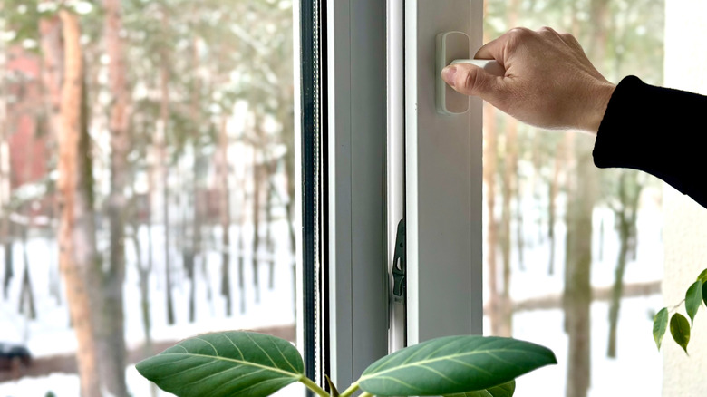 opening window for ventilation in winter