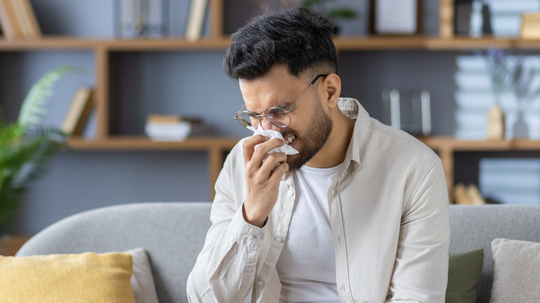 guy with allergies dealing with air quality issues