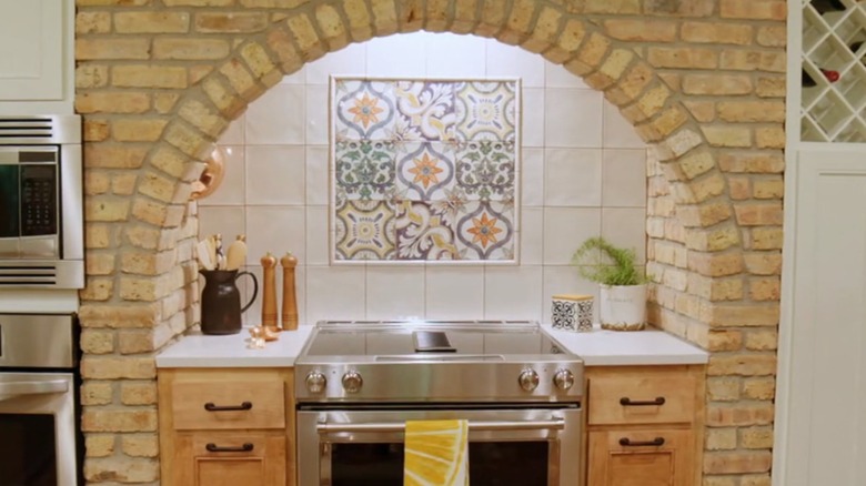 a contemporary kitchen with colorful backsplash