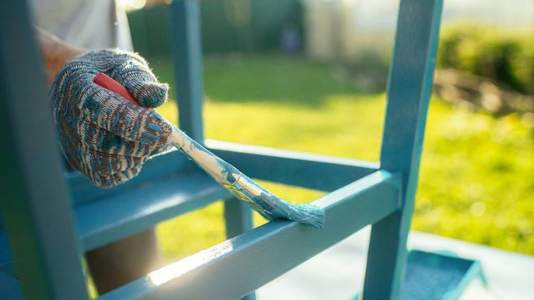 Hand painting furniture with brush