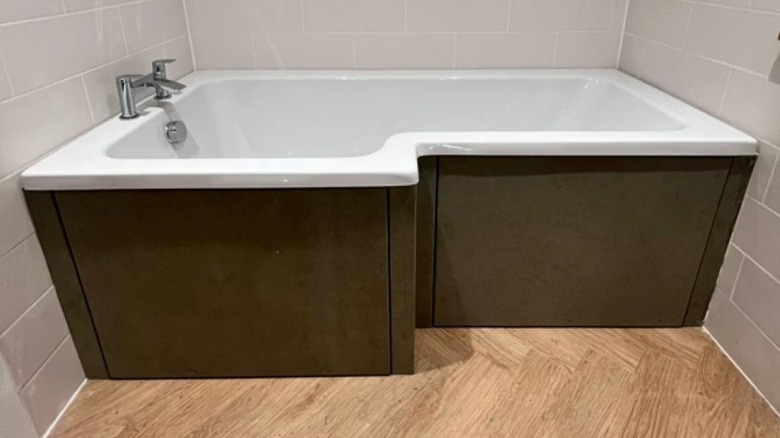 A bathtub with built-in storage drawers
