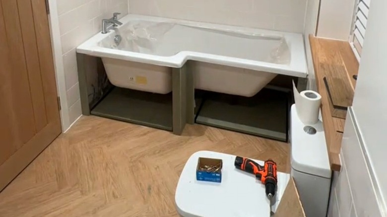 Framing for drawers under a drop in bathtub