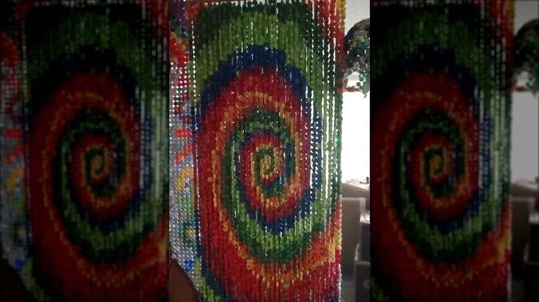 A beaded curtain made from bottle caps