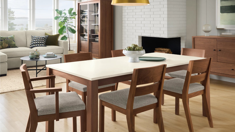 a dining table and chairs from Room & Board