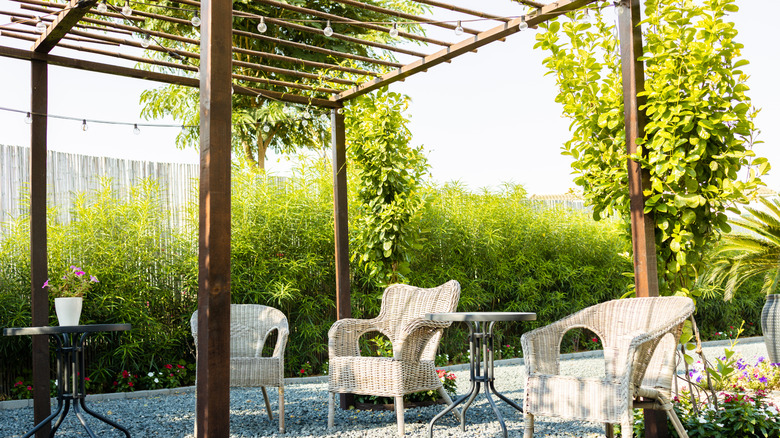 Open outdoor patio with a pergola and seating.