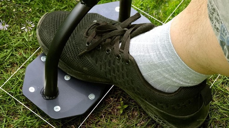 Person using Jardineer Lawn Aerator on their lawn.