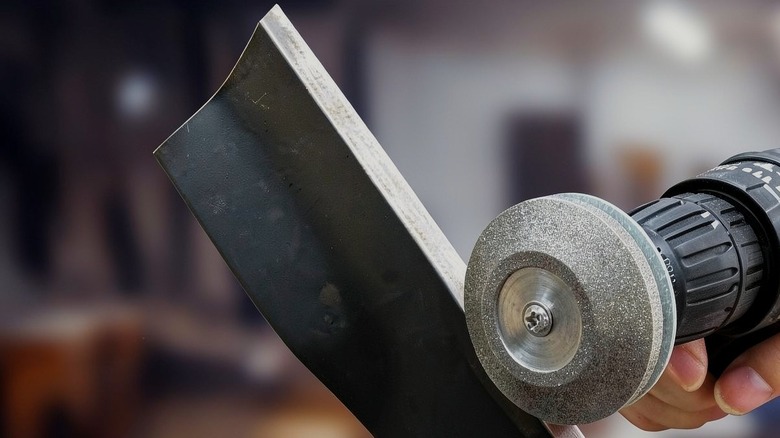 UF-SHARP diamond lawn mower blade sharpener attached to a drill