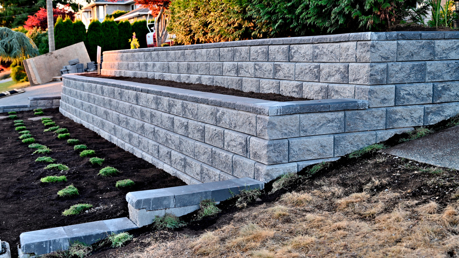 Forget Pricey Concrete And Stone — There's A Cheaper Way To Build A Retaining Wall