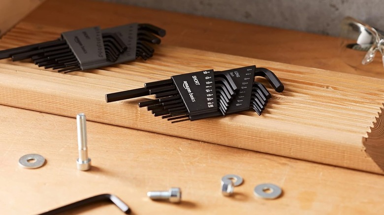Amazon Basics Hex Key Set on top of a plank of wood on a work table