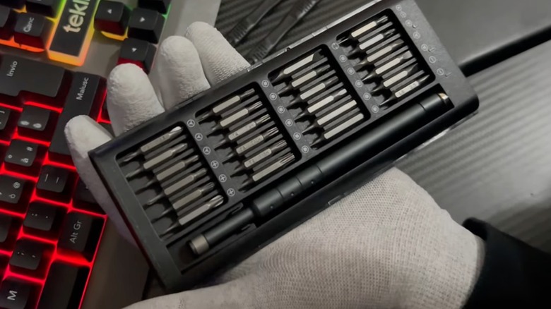 Person holding Jorest 52-IN-1 Precision Screwdriver Set