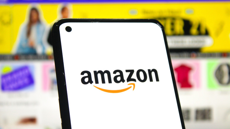 Closeup of person pulling up Amazon app on phone