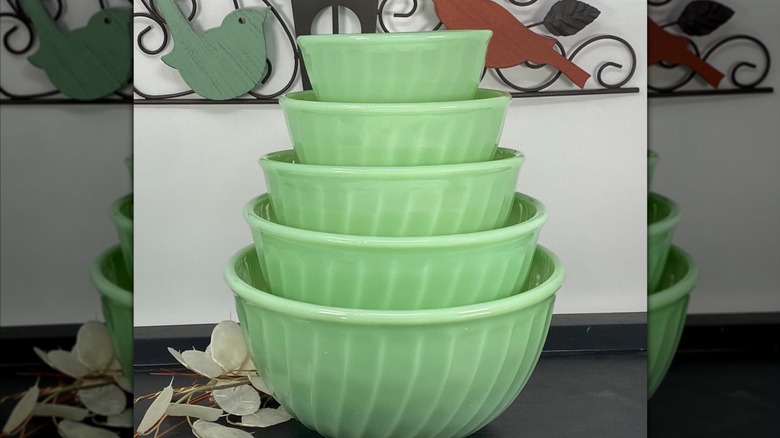 A set of five jade-ite fire-king swirl bowls stacked.