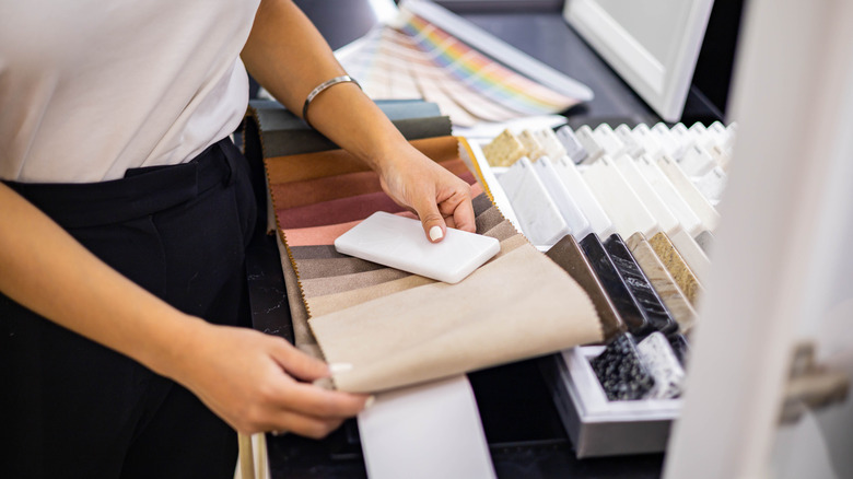 Person looking at countertop samples at a store