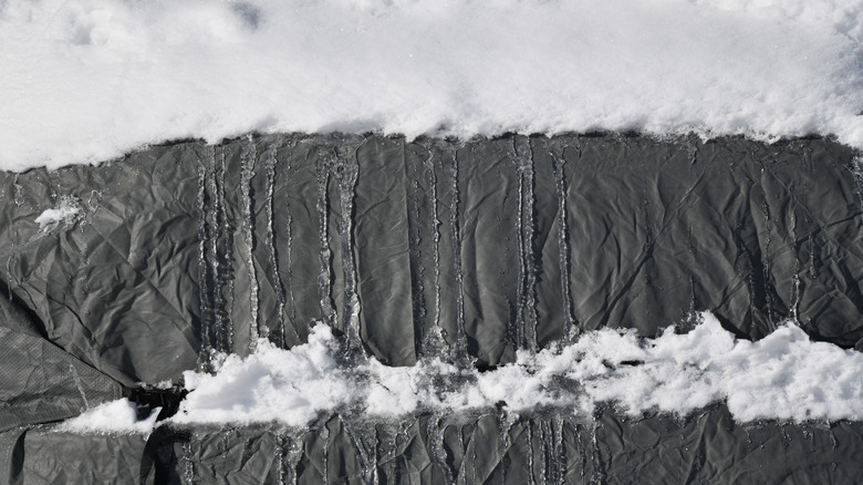 snow and ice on a tarp