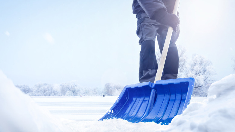 a man shovels snow