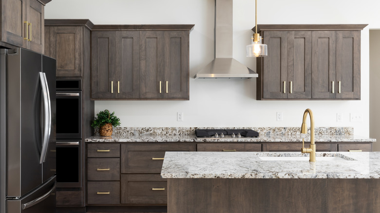 Kitchen with dark wood cabinets