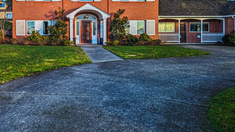 Traditional asphalt driveway in need of repair or replacement