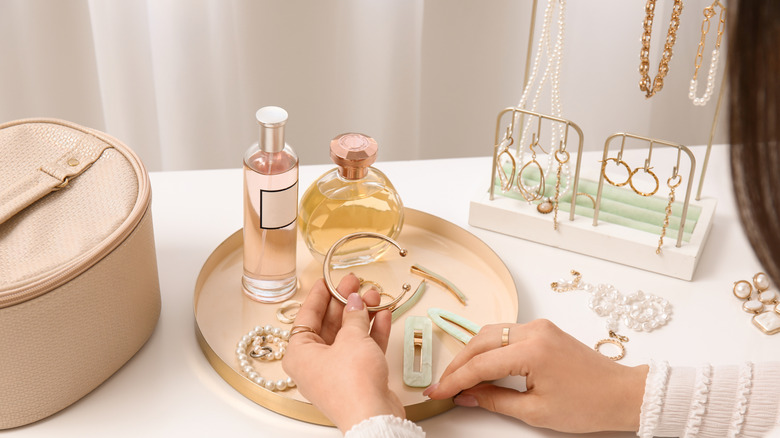Woman looking through her jewelry collection