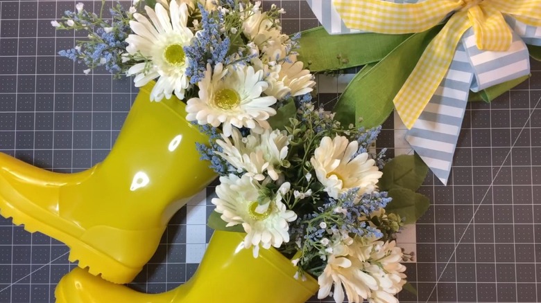 Floral filled boots with hanging ribbon
