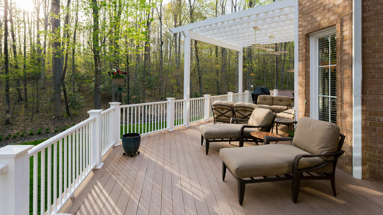 Suburban deck with patio furniture and pergola