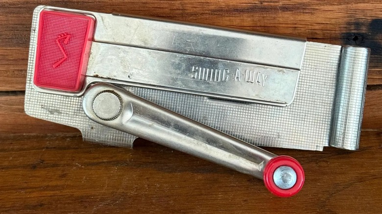 A Swing-A-Way wall mounted can opener