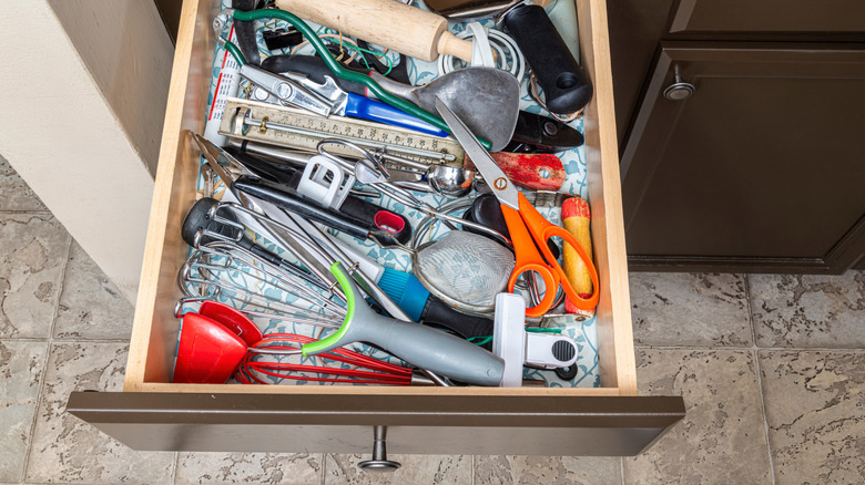 cluttered kitchen drawer