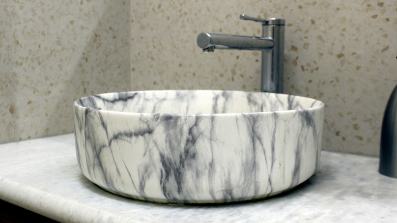 Round bathroom sink with a marble pattern