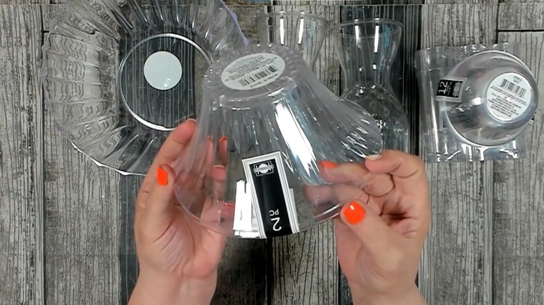 Creator assembling Dollar Tree bowls and vases on a work surface