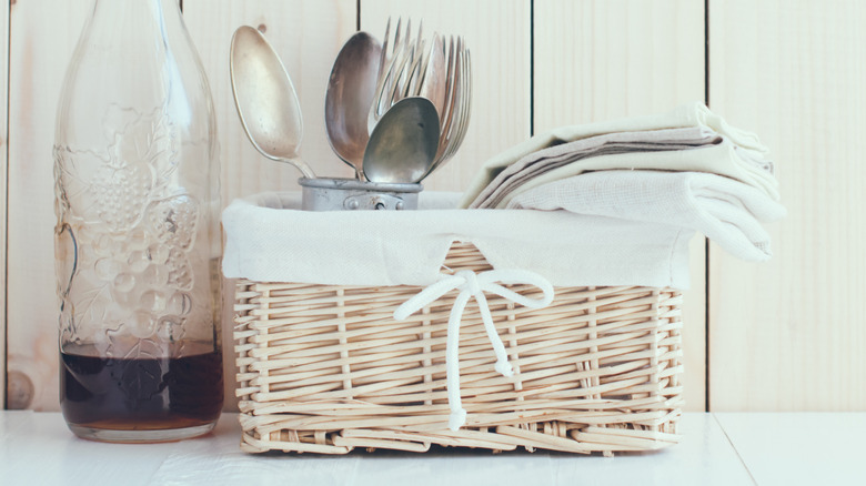 Silverware in a woven basket caddy