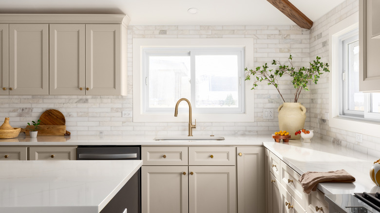 modern kitchen with warm beige cabinets