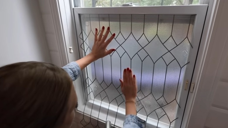 Applying window cling film to a kitchen window