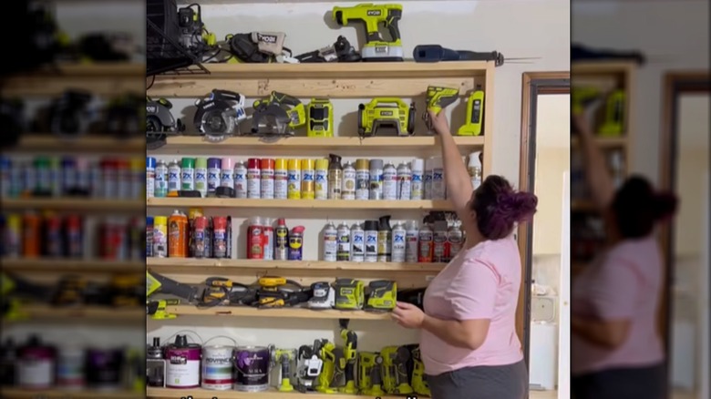 Woman putting a tool on a narrow garage shelf she built