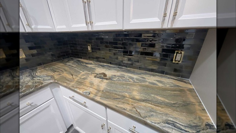 quartzite countertop against white cabinets