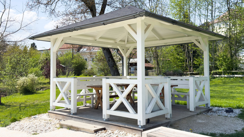 White wooden gazebo covering patio