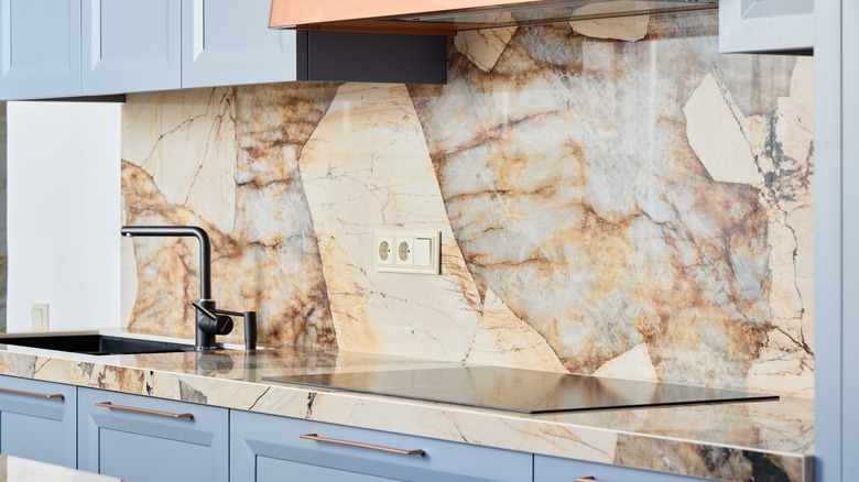 a marble countertop that matches the backsplash