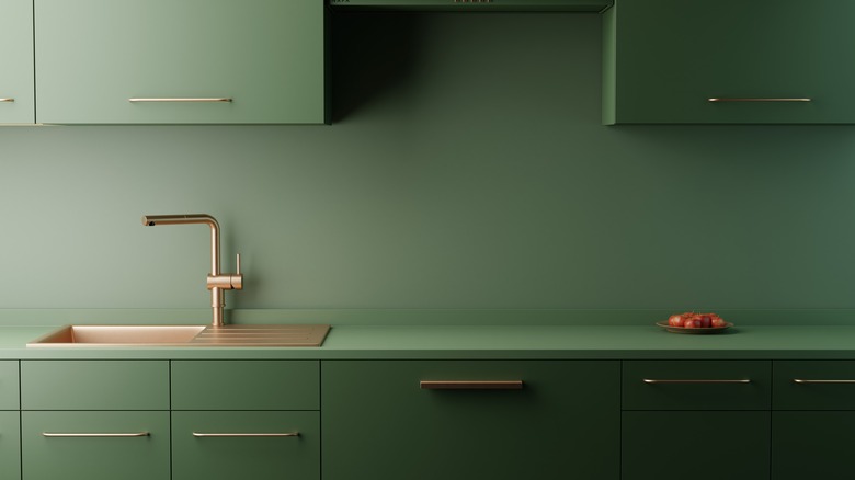 a monochromatic green kitchen
