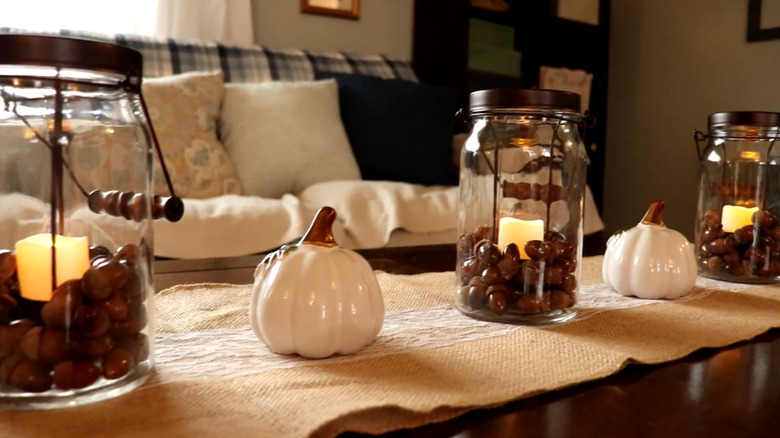 jars filled with acorns and flame-free candles