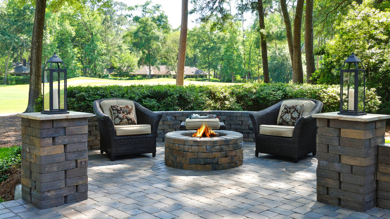 an outdoor fire pit surrounded by seating