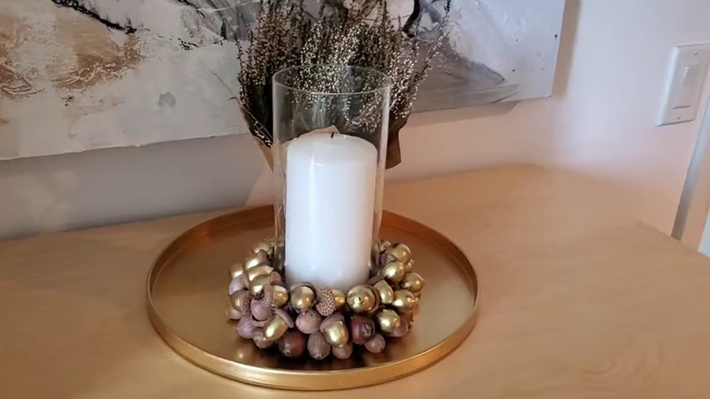 a candle ring made from acorns