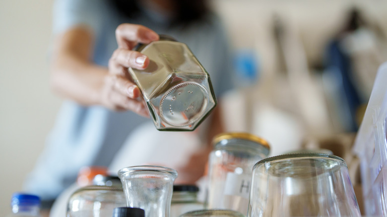 Woman organizing glass jars