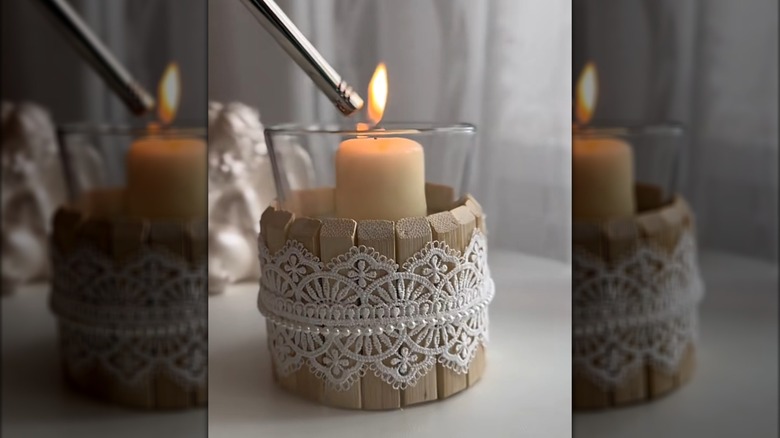 Candle holder made from disassembled clothespins with lace and beads around it