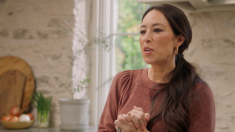 Image of Joanna Gaines smiling in the Gristmill kitchen.